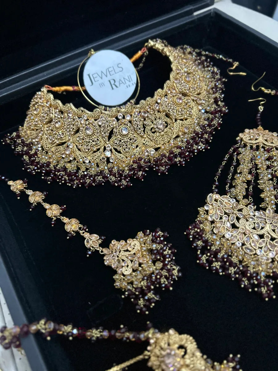 Deep Maroon & Gold Collar Necklace set, with heavily beaded earrings & tikka. - Jewelsbyrani