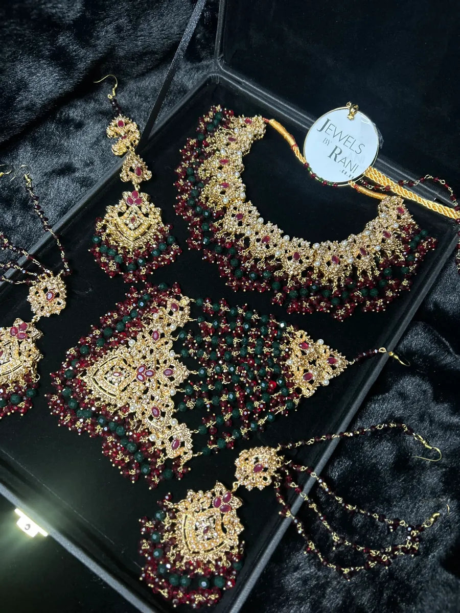 Green, Gold & Maroon Bridal Jewellery set, with heavily beaded earrings & tikka. - Jewelsbyrani