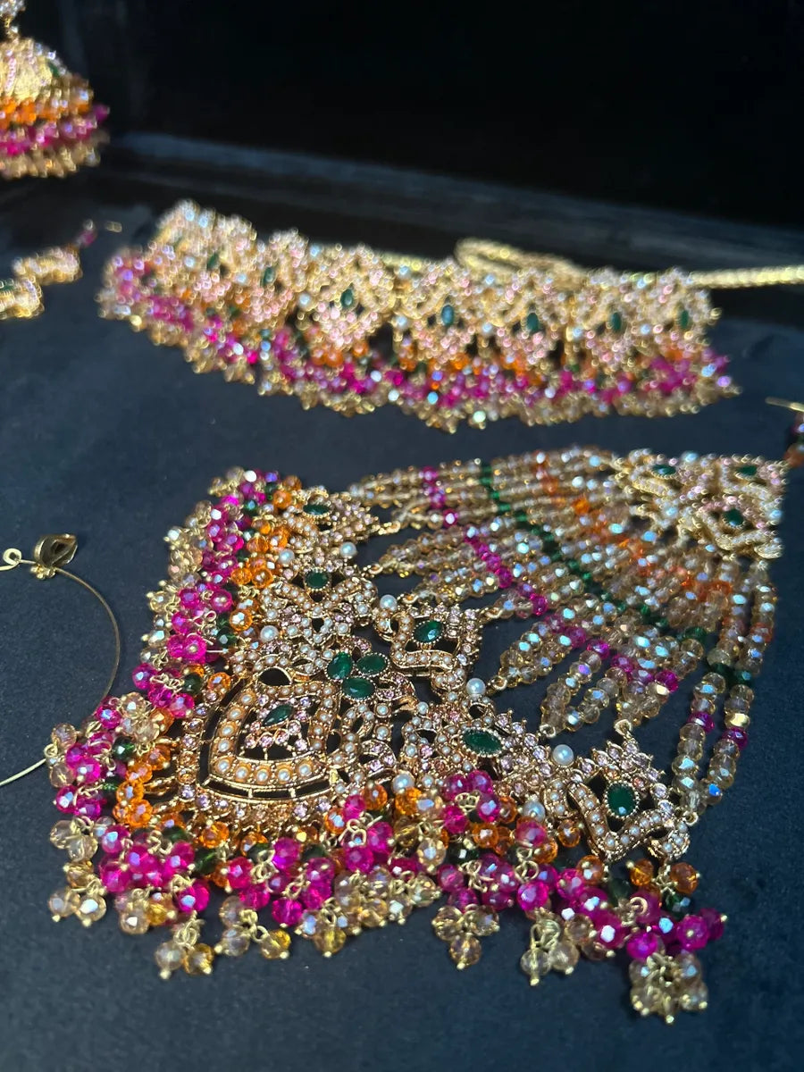 Multi Choker Green, Orange & Hot Pink coloured necklace set, with heavily beaded Jhumkies & tikka | Gold Stones - Jewelsbyrani
