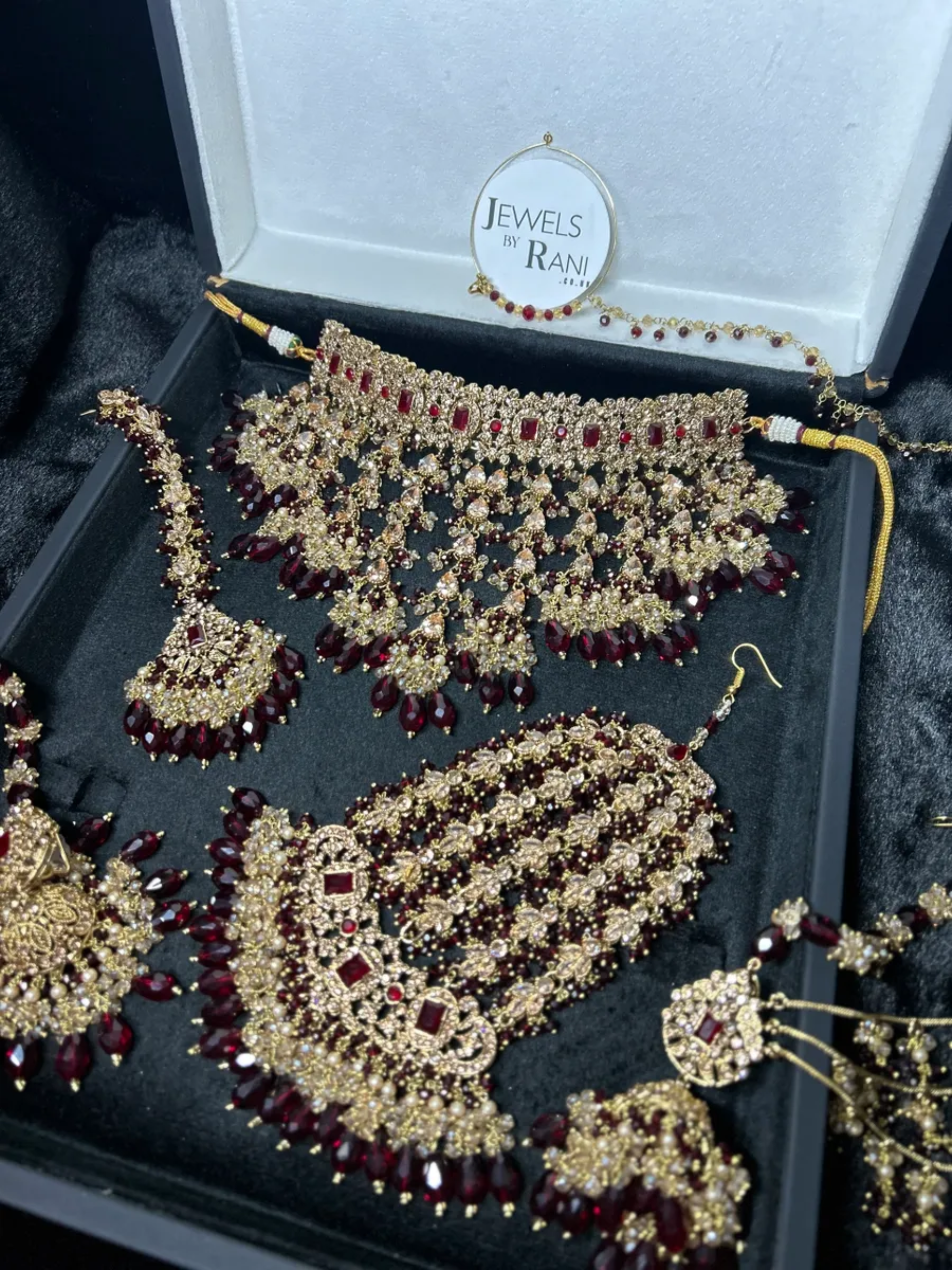 Pre Order 6 Week: Trending Dangled Crystal Maroon 24 crt Gold Plated Bridal Jewellery Set - Jewelsbyrani