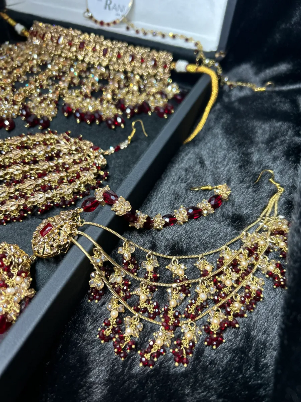 Pre Order 6 Week: Trending Dangled Crystal Maroon 24 crt Gold Plated Bridal Jewellery Set - Jewelsbyrani