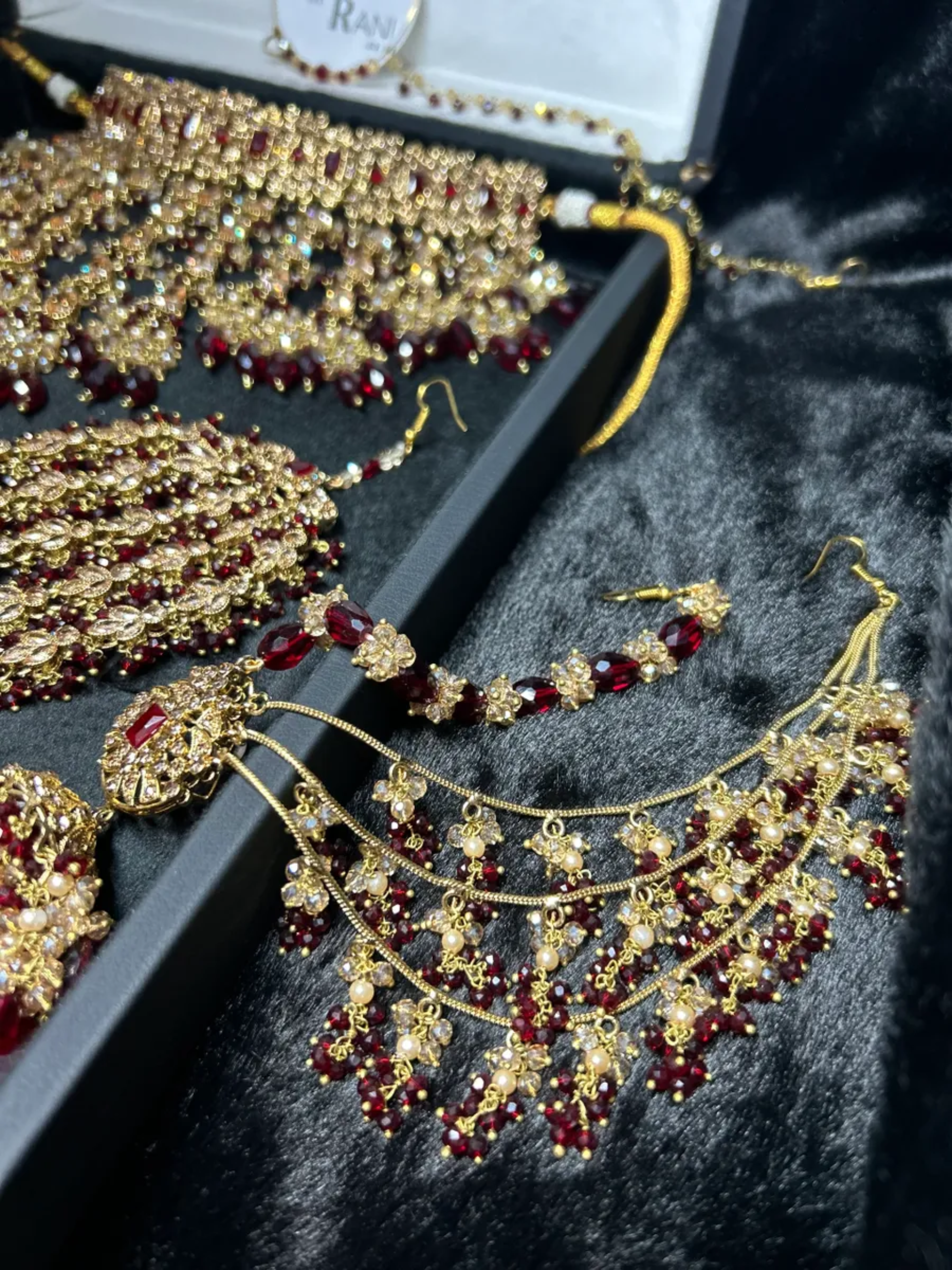 Pre Order 6 Week: Trending Dangled Crystal Maroon 24 crt Gold Plated Bridal Jewellery Set