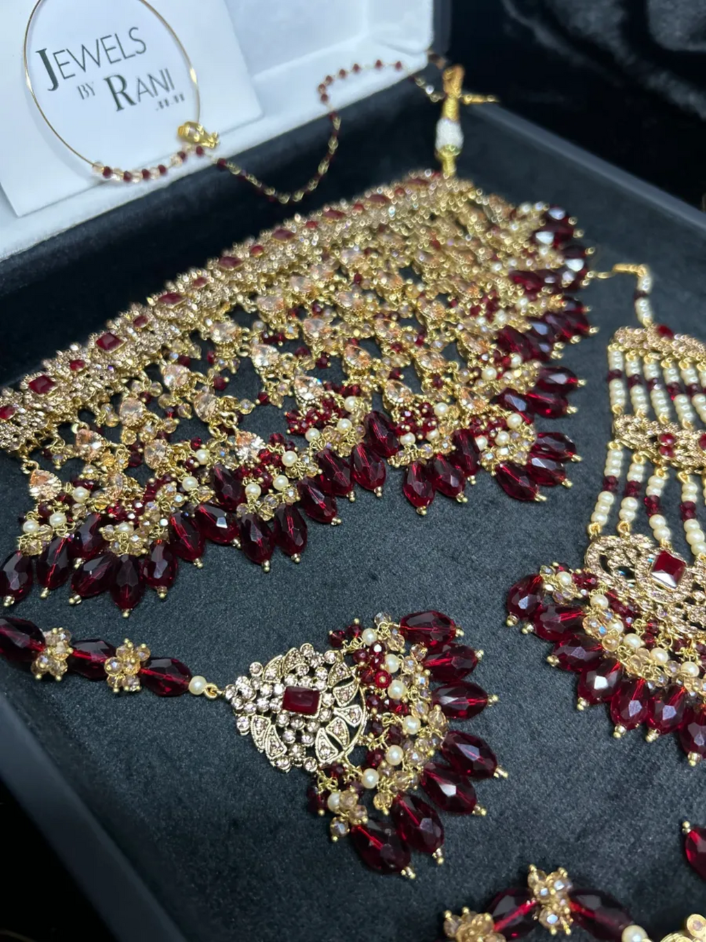 Pre Order 6 Week: Trending Dangled Crystal Deep Red 24 crt Gold Plated Bridal Jewellery Set - Jewelsbyrani
