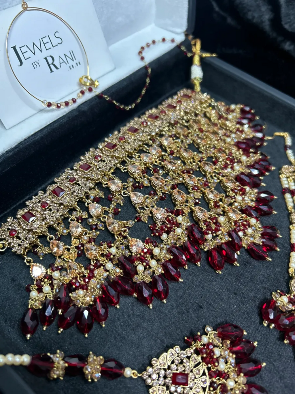 Pre Order 6 Week: Trending Dangled Crystal Deep Red 24 crt Gold Plated Bridal Jewellery Set - Jewelsbyrani