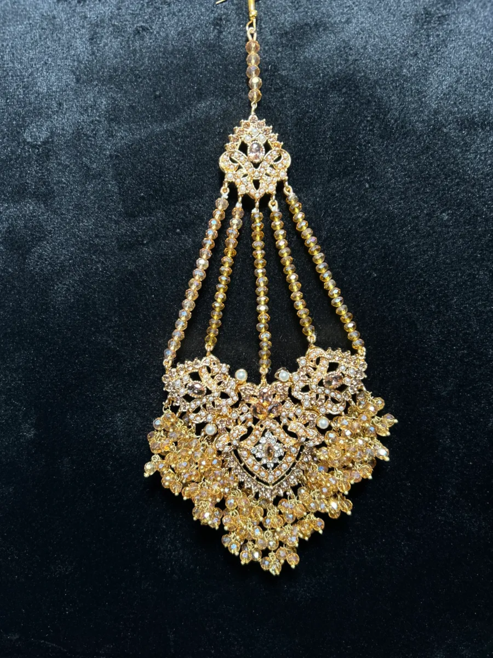 Gold heavily beaded Jhumar.