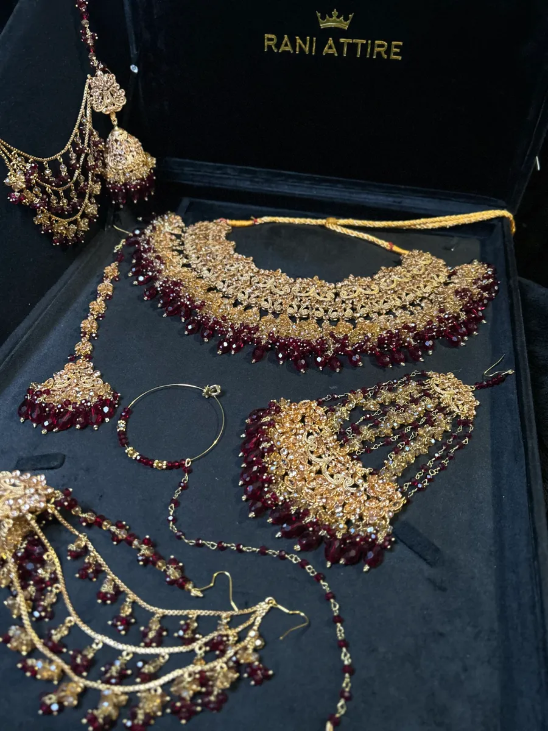 Luxury Maroon Crystals & Gold set, with heavily beaded earrings & tikka.