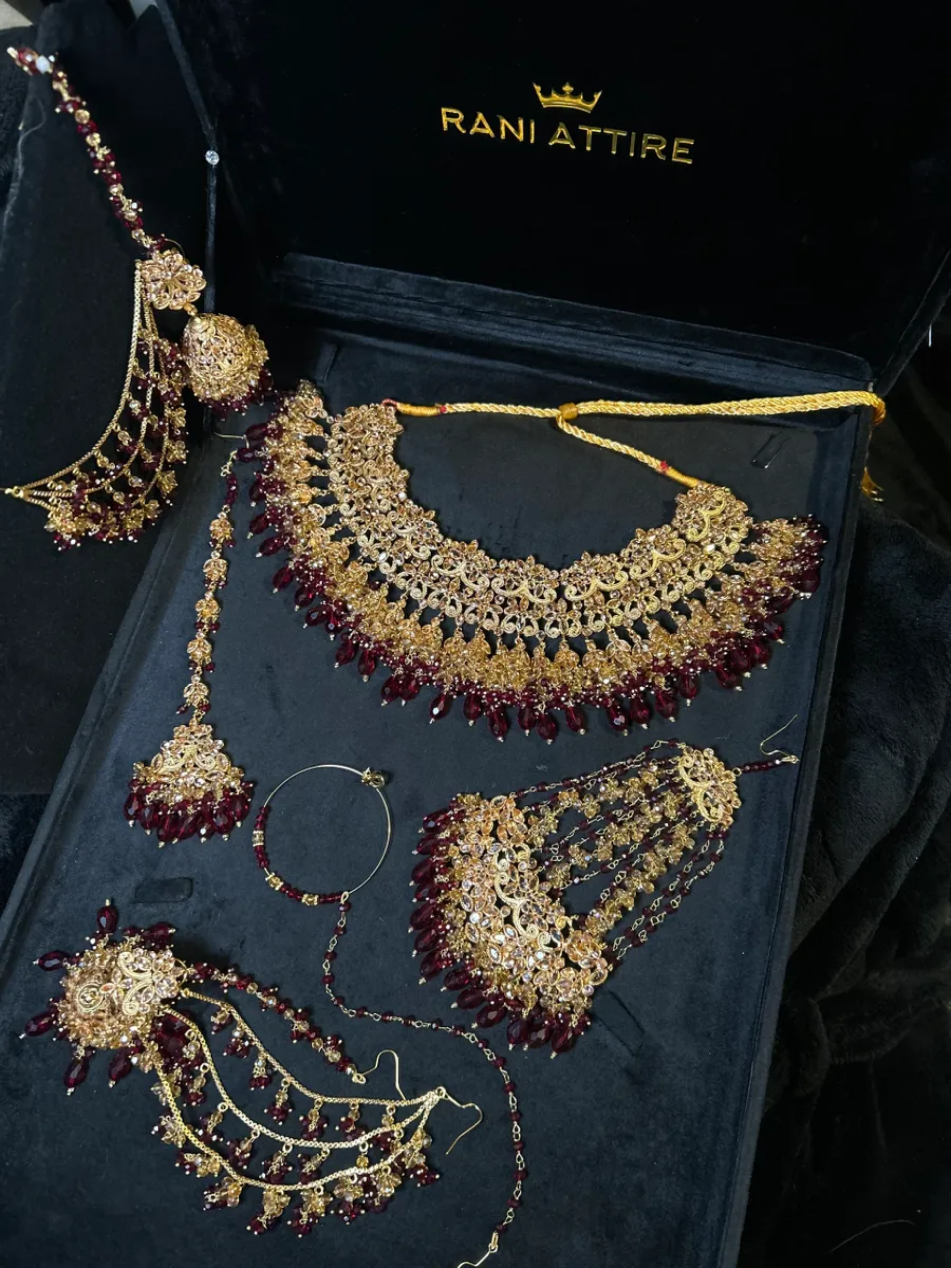 Luxury Maroon Crystals & Gold set, with heavily beaded earrings & tikka.