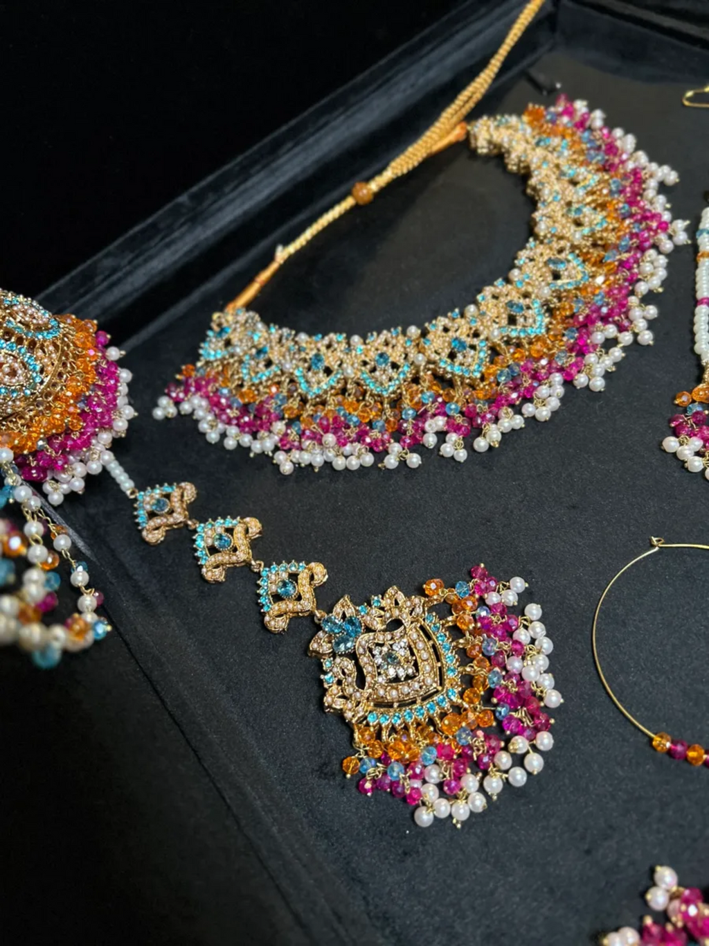 Multi Baby blue, Orange & Hot Pink coloured Mehndi necklace set, with heavily beaded Jhumkies & tikka | Gold Stones - Jewelsbyrani