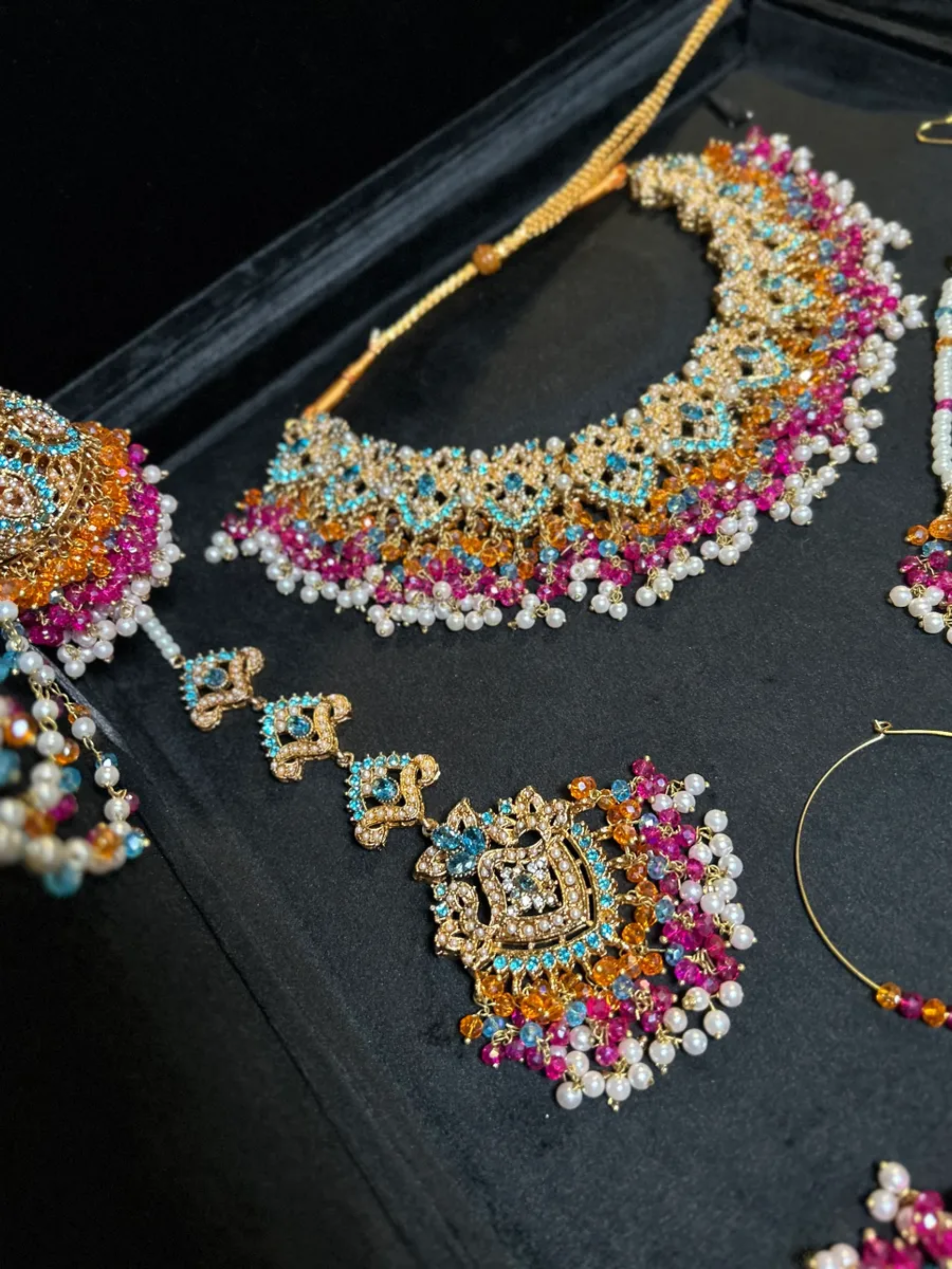 Multi Baby blue, Orange & Hot Pink coloured Mehndi necklace set, with heavily beaded Jhumkies & tikka | Gold Stones - Jewelsbyrani