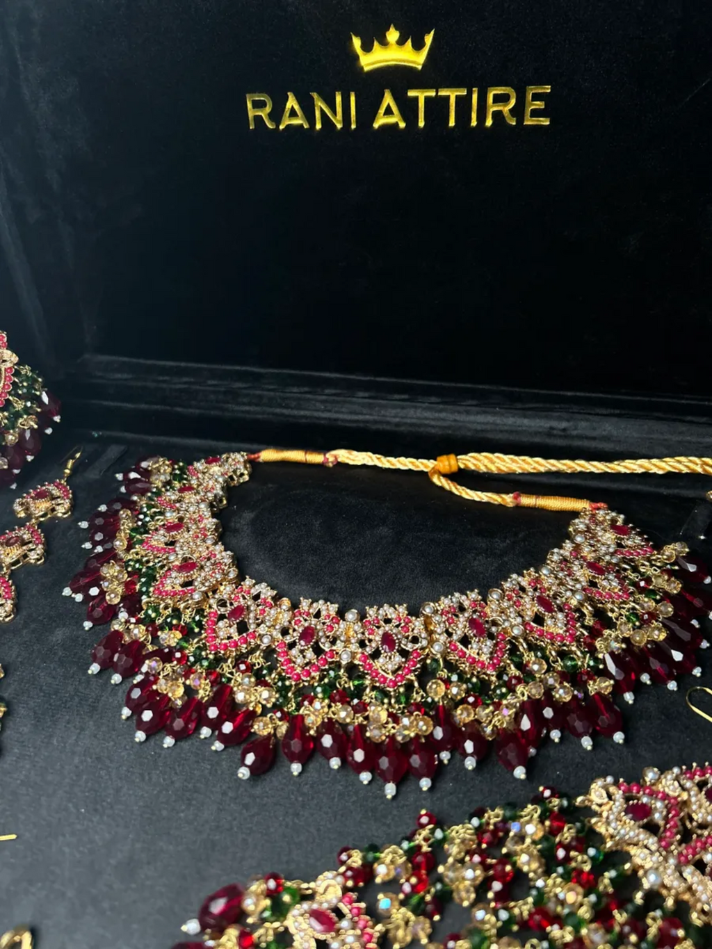 Green and Maroon Crystal set, with heavily beaded jhumkies & tikka. - Jewelsbyrani