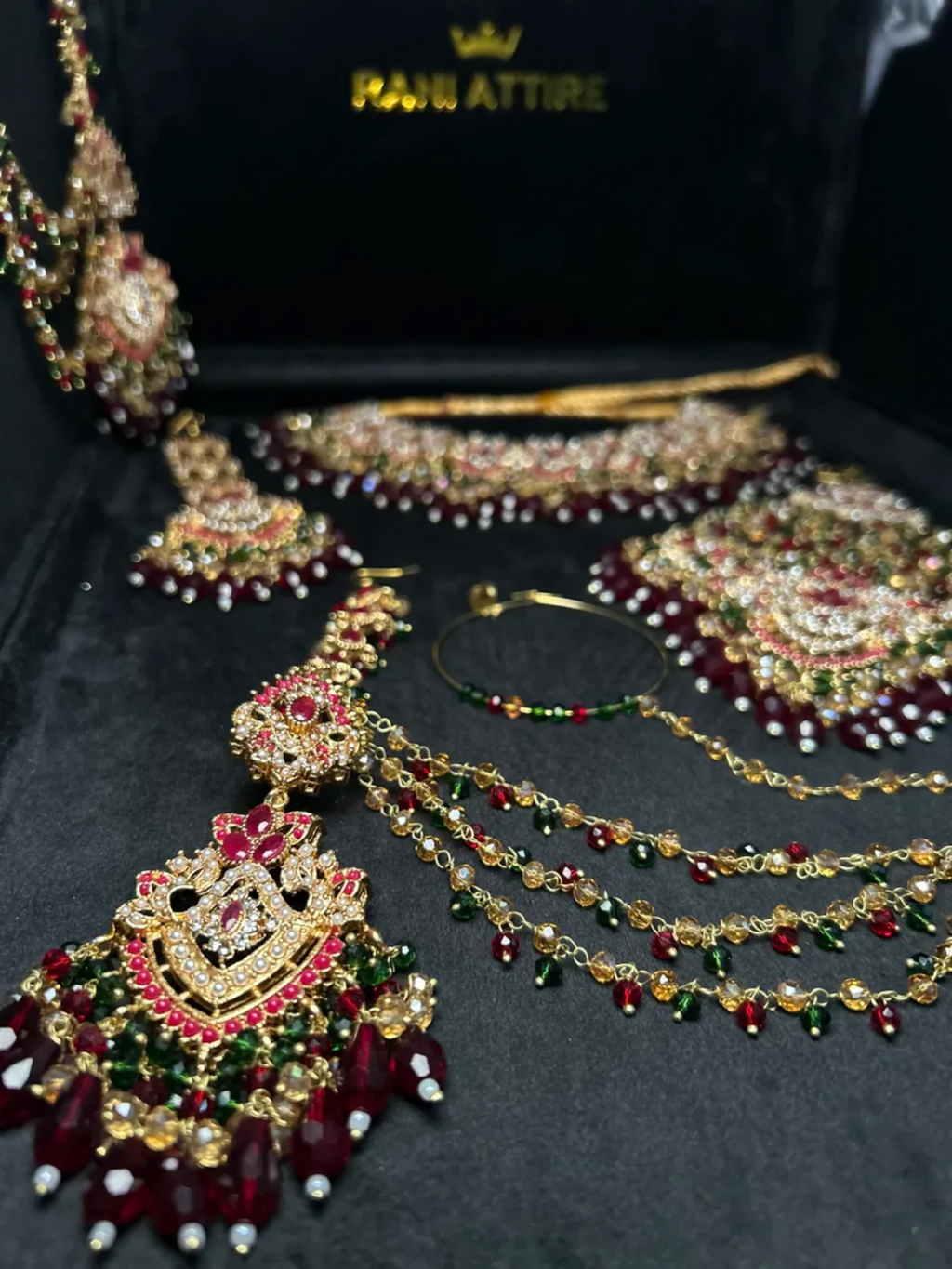 Green and Maroon Crystal set, with heavily beaded jhumkies & tikka. - Jewelsbyrani