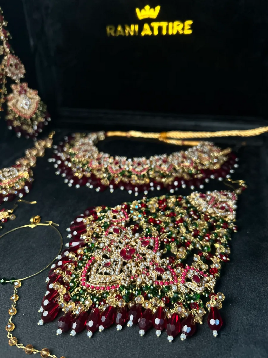 Green and Maroon Crystal set, with heavily beaded jhumkies & tikka. - Jewelsbyrani