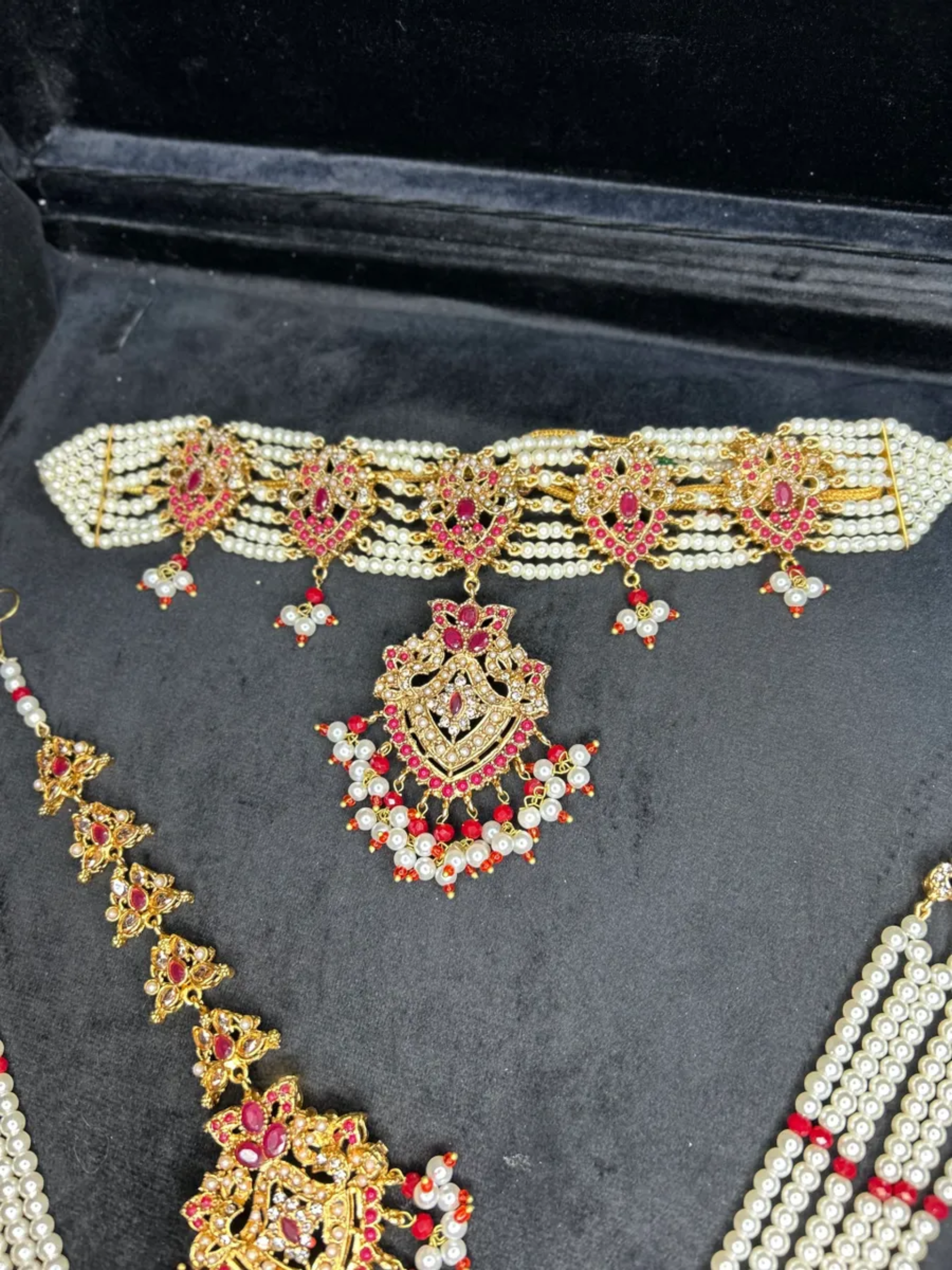 Gold & Red Choker set, with heavily beaded jhumkies & tikka.
