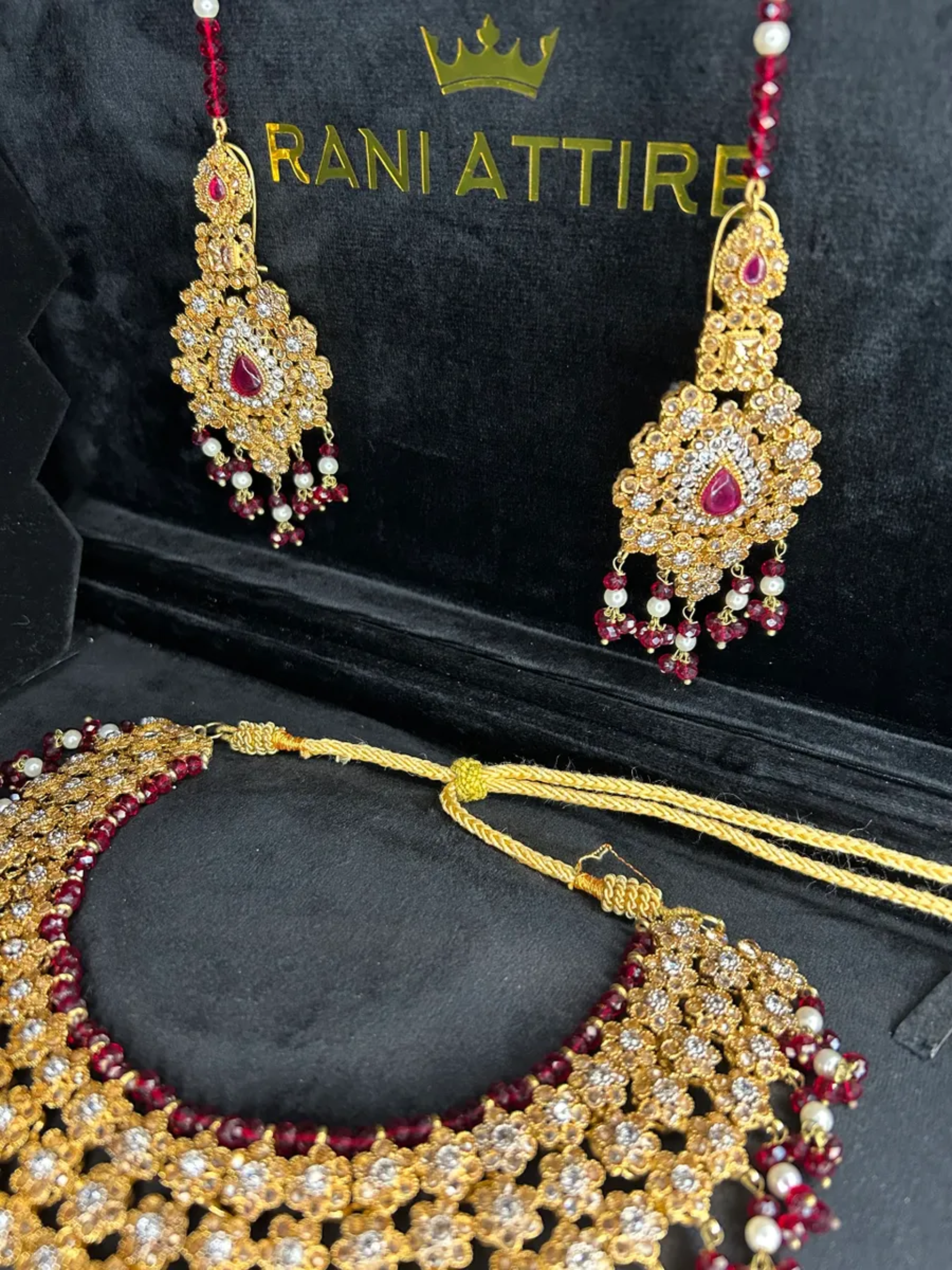 Gold & Maroon set, with heavily beaded jhumkies & tikka.
