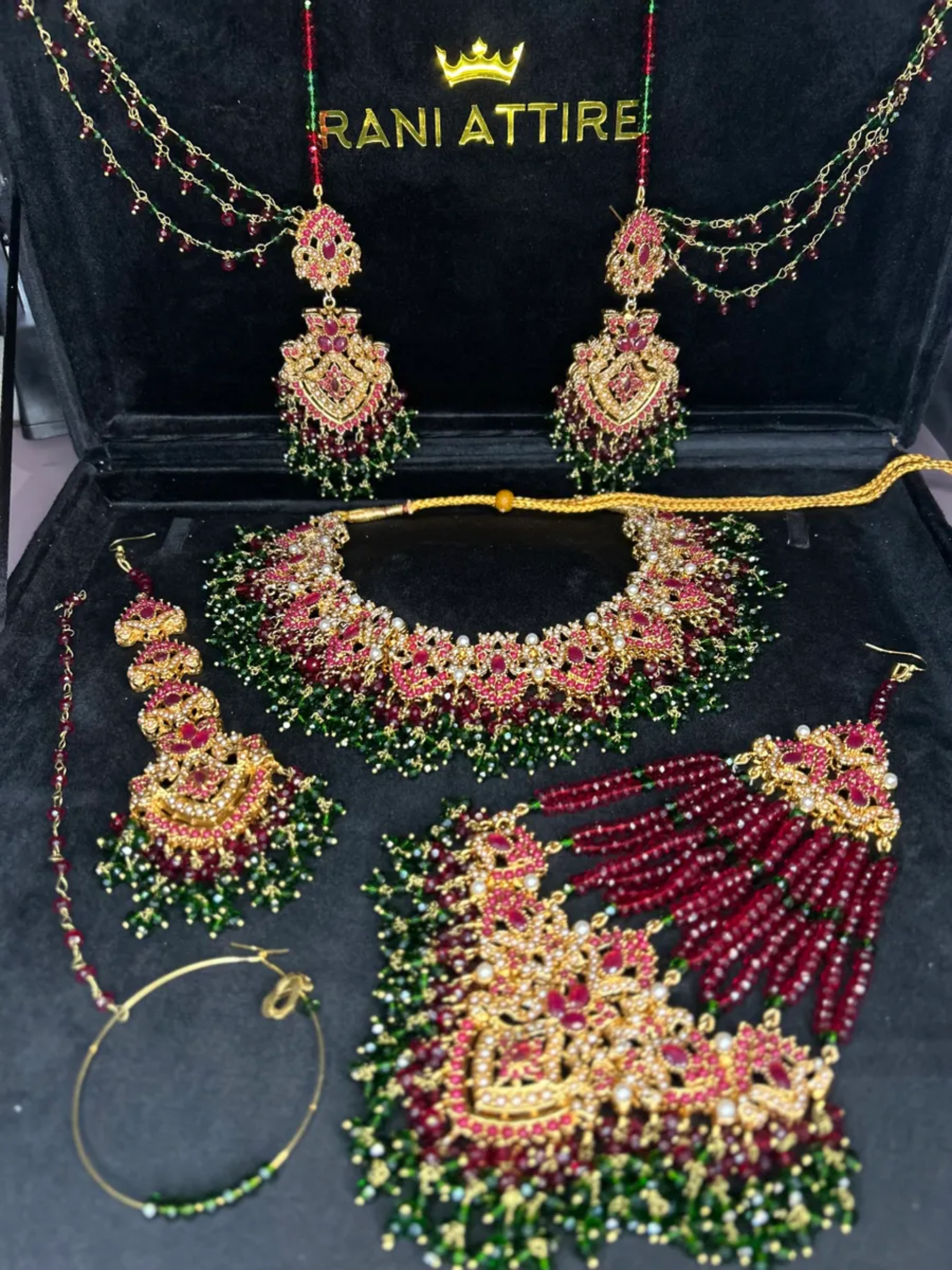Gold,Green & Maroon set, with heavily beaded jhumkies & tikka.