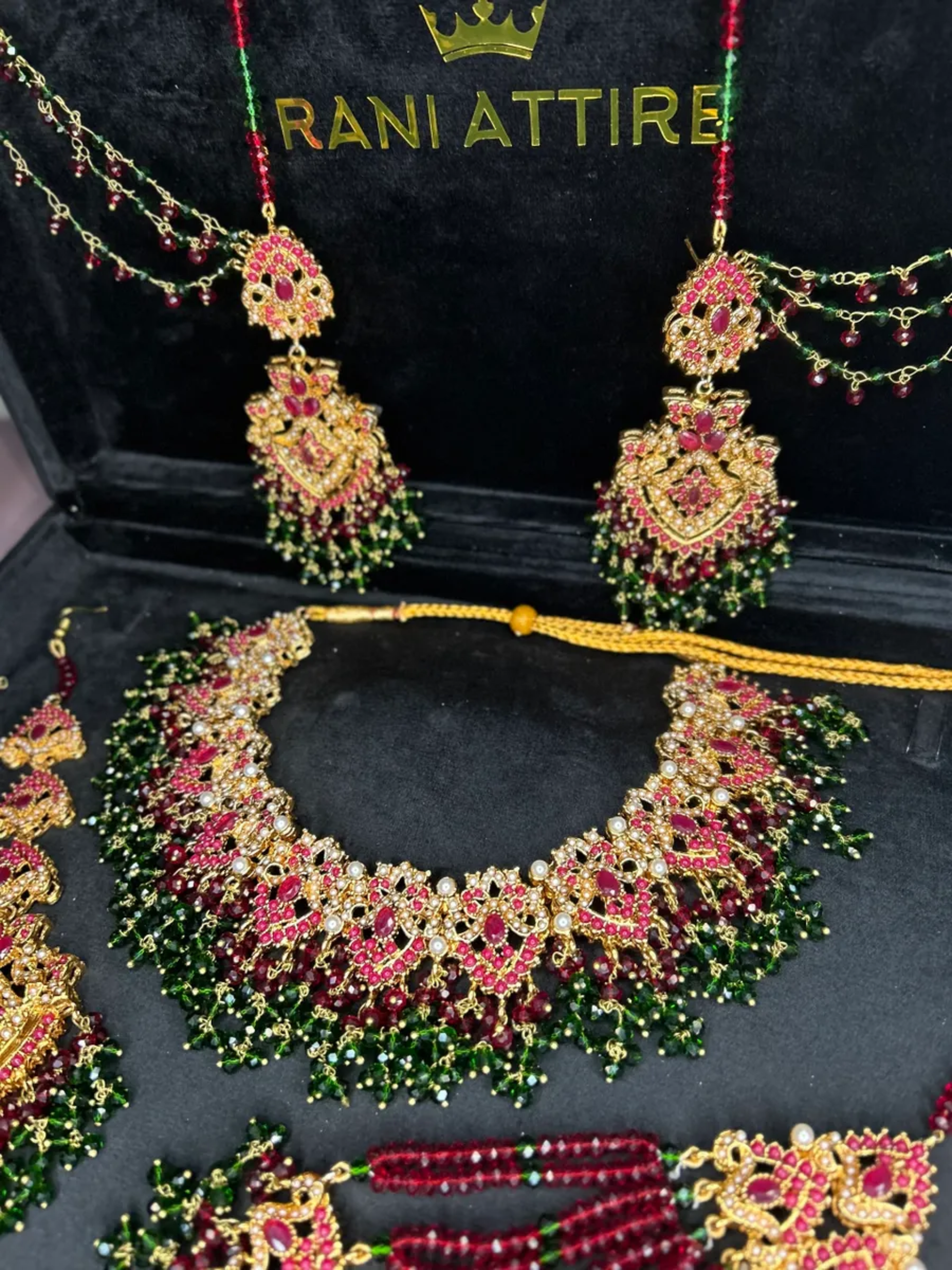 Gold,Green & Maroon set, with heavily beaded jhumkies & tikka.