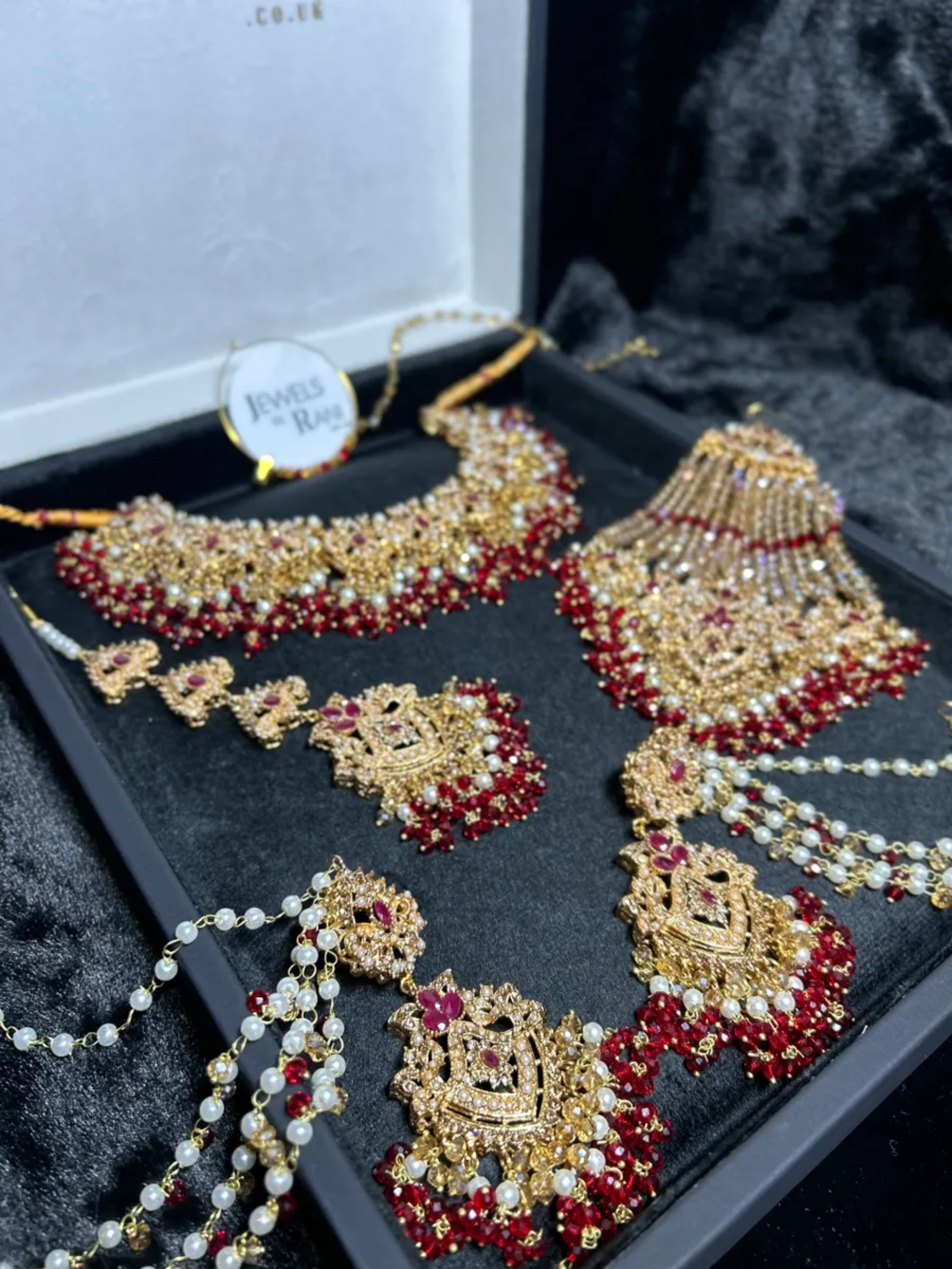 Gold, Deep Red & white set Bridal Jewellery Set with heavily beaded earrings & tikka. - Jewelsbyrani