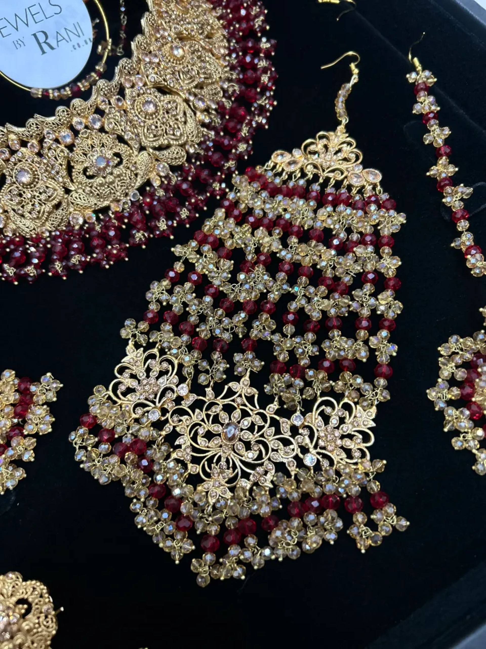 Deep Red & Gold Collar Necklace set, with heavily beaded earrings & tikka. - Jewelsbyrani