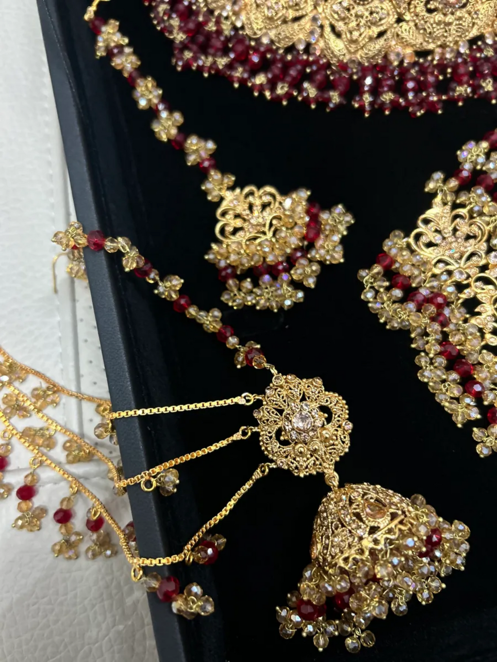 Deep Red & Gold Collar Necklace set, with heavily beaded earrings & tikka. - Jewelsbyrani