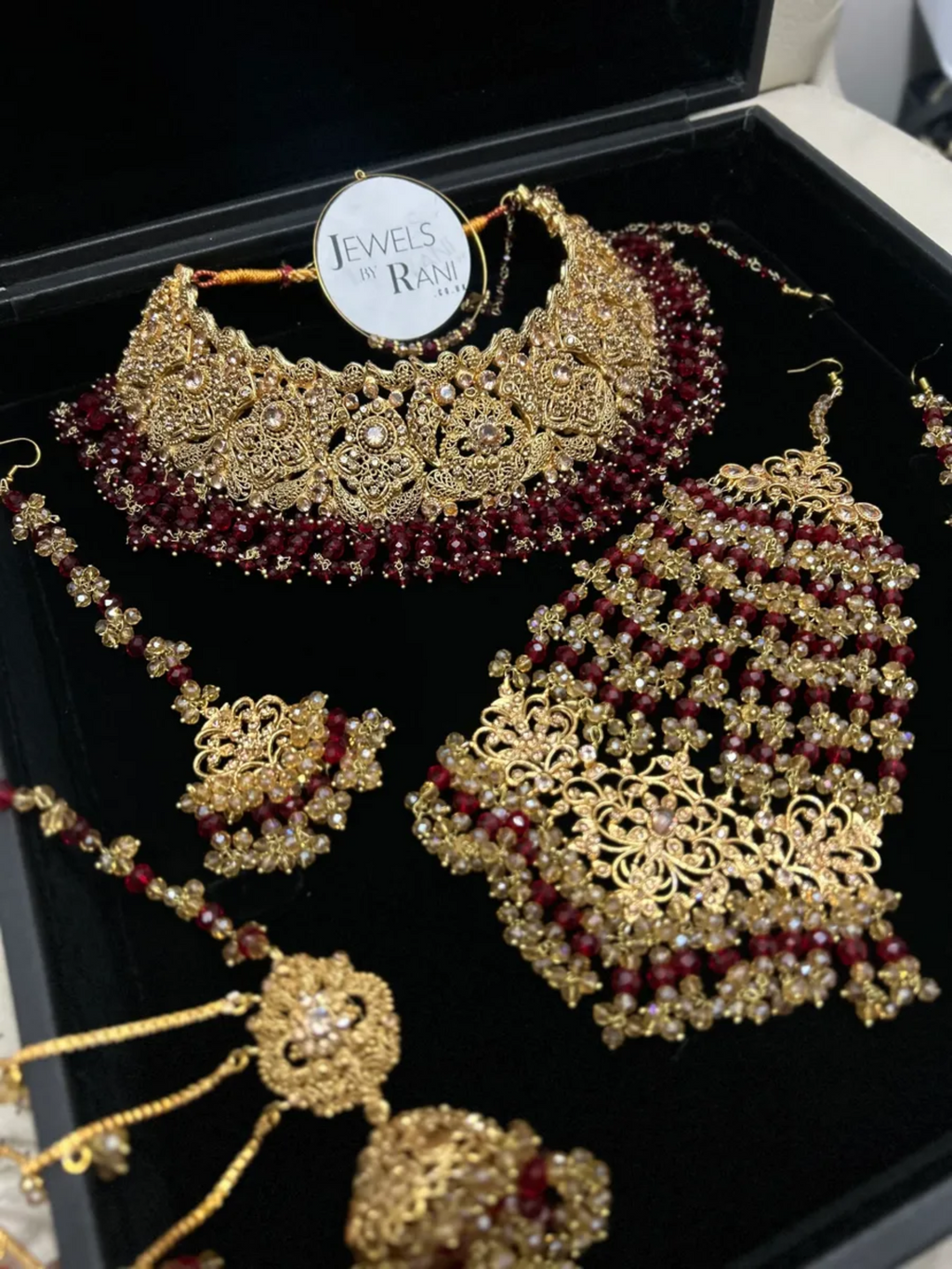 Deep Red & Gold Collar Necklace set, with heavily beaded earrings & tikka. - Jewelsbyrani