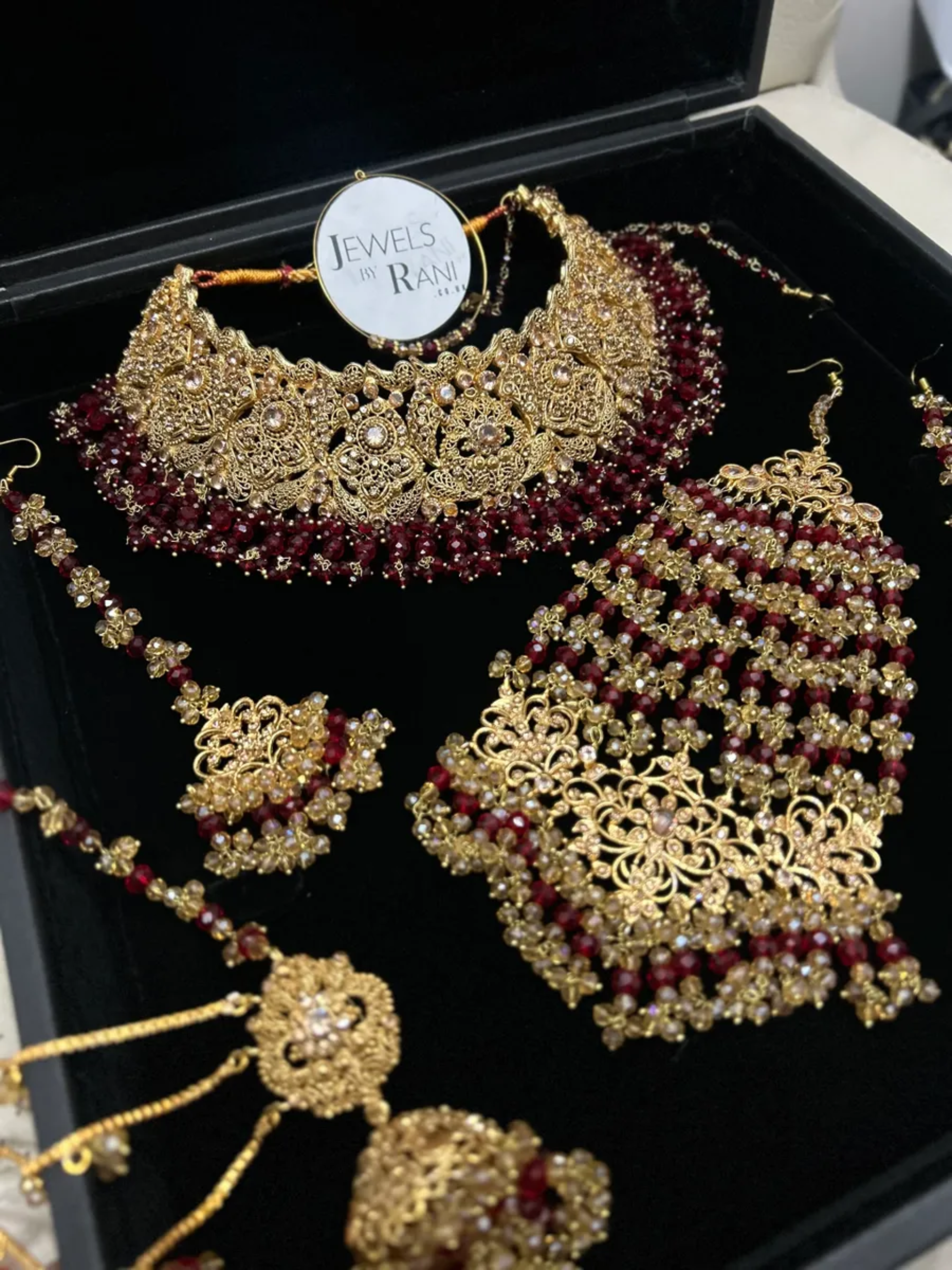 Deep Red & Gold Collar Necklace set, with heavily beaded earrings & tikka. - Jewelsbyrani