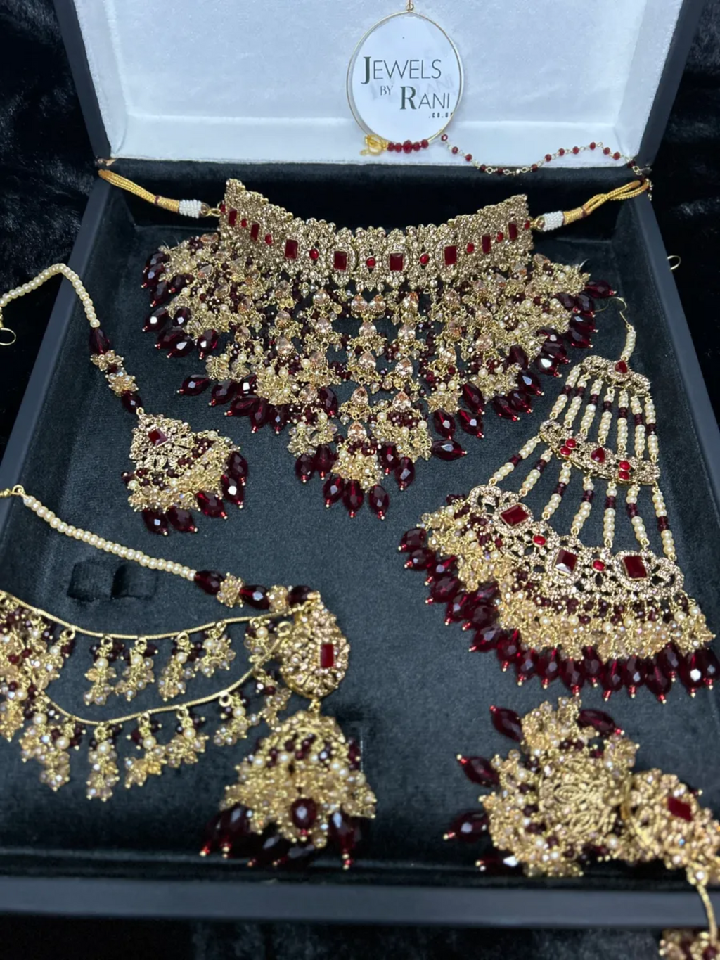 PRE ORDER: 6 Week Making time- Trending Dangled Crystal Maroon 24 crt Gold Plated Bridal Jewellery Set - Jewelsbyrani