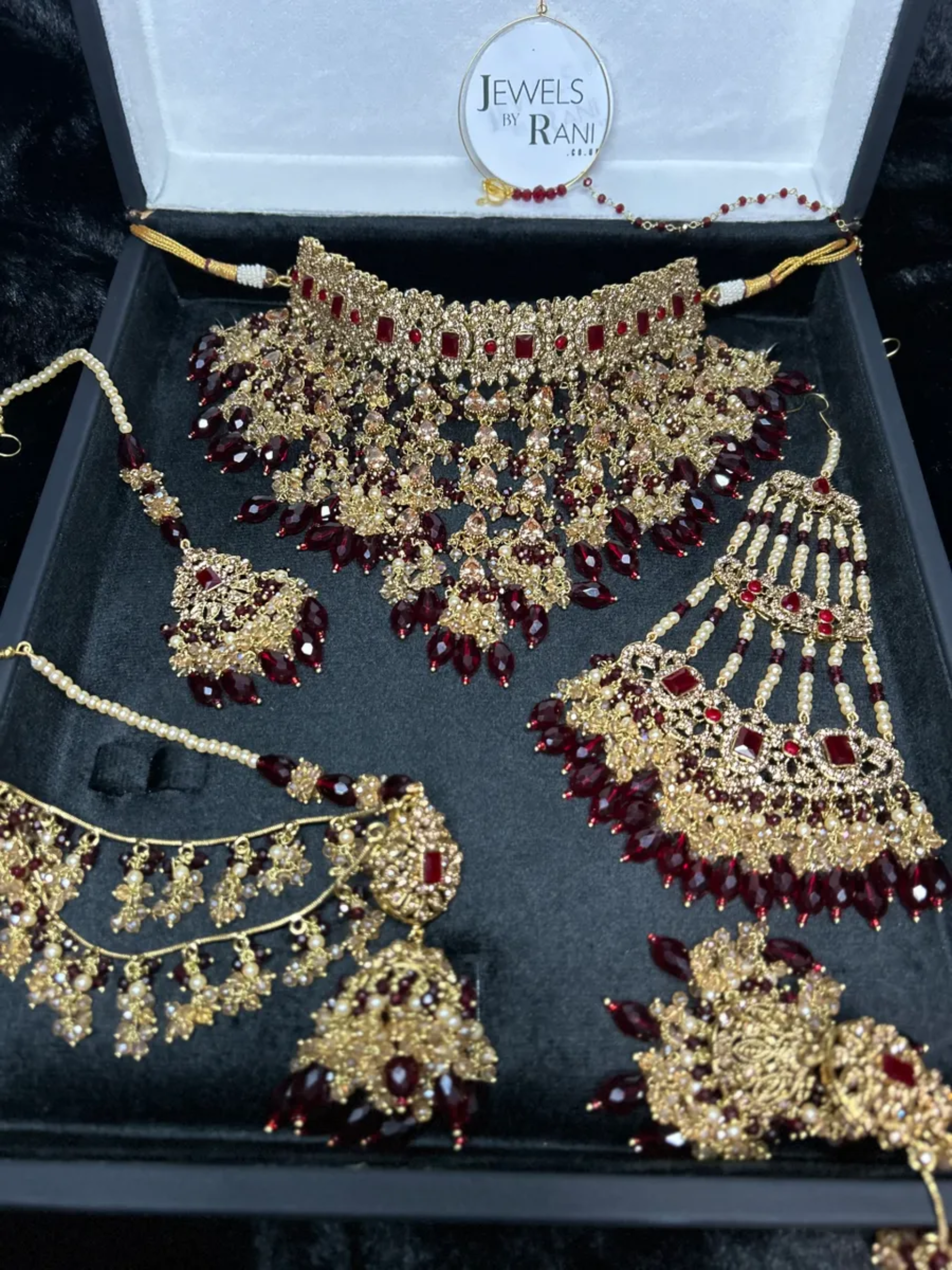 PRE ORDER: 6 Week Making time- Trending Dangled Crystal Maroon 24 crt Gold Plated Bridal Jewellery Set - Jewelsbyrani