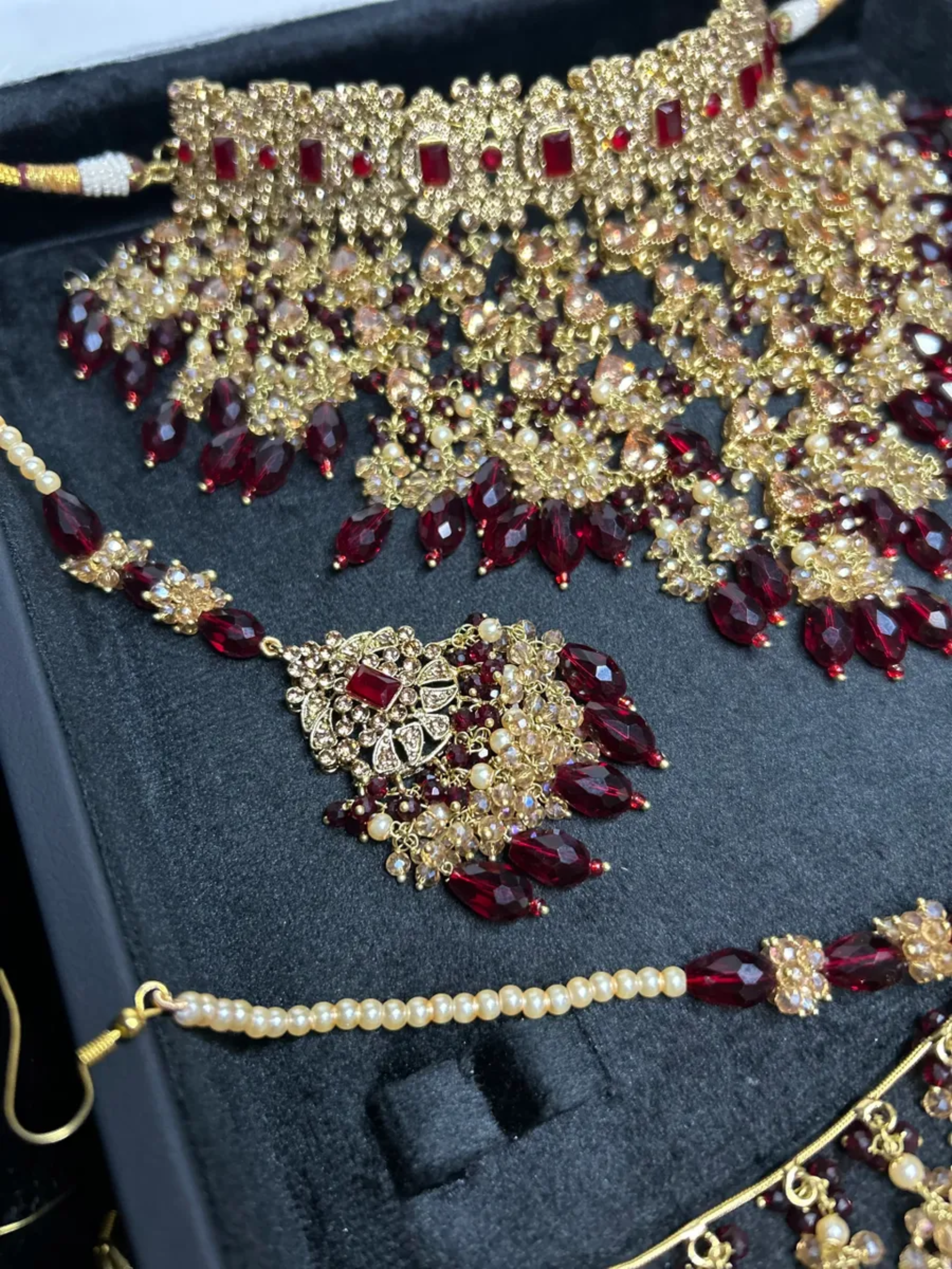 PRE ORDER: 6 Week Making time- Trending Dangled Crystal Maroon 24 crt Gold Plated Bridal Jewellery Set - Jewelsbyrani