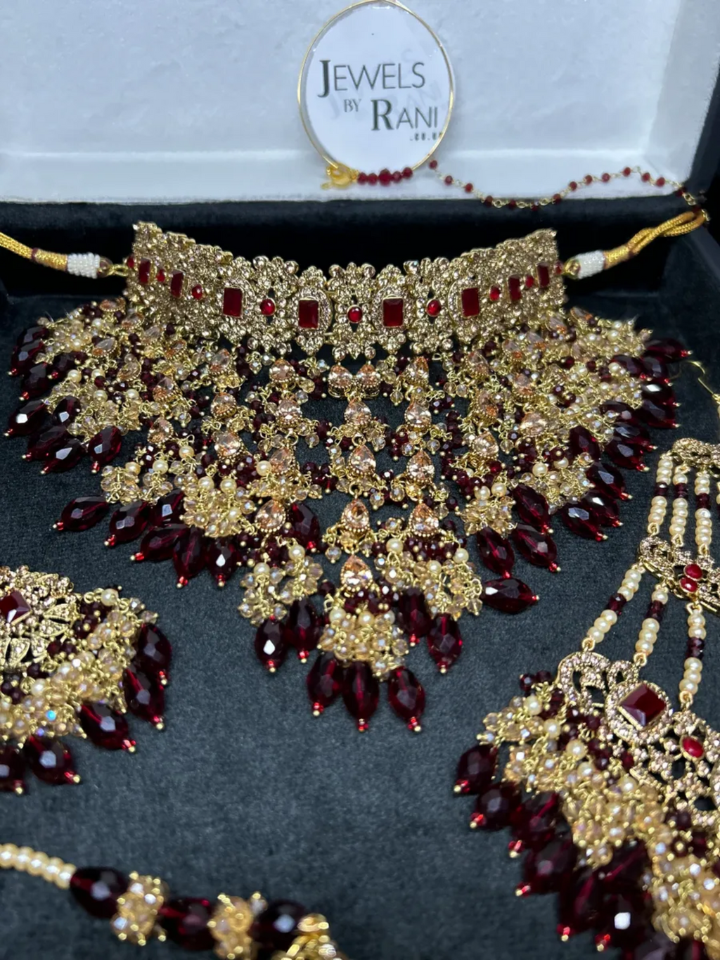 PRE ORDER: 6 Week Making time- Trending Dangled Crystal Maroon 24 crt Gold Plated Bridal Jewellery Set - Jewelsbyrani