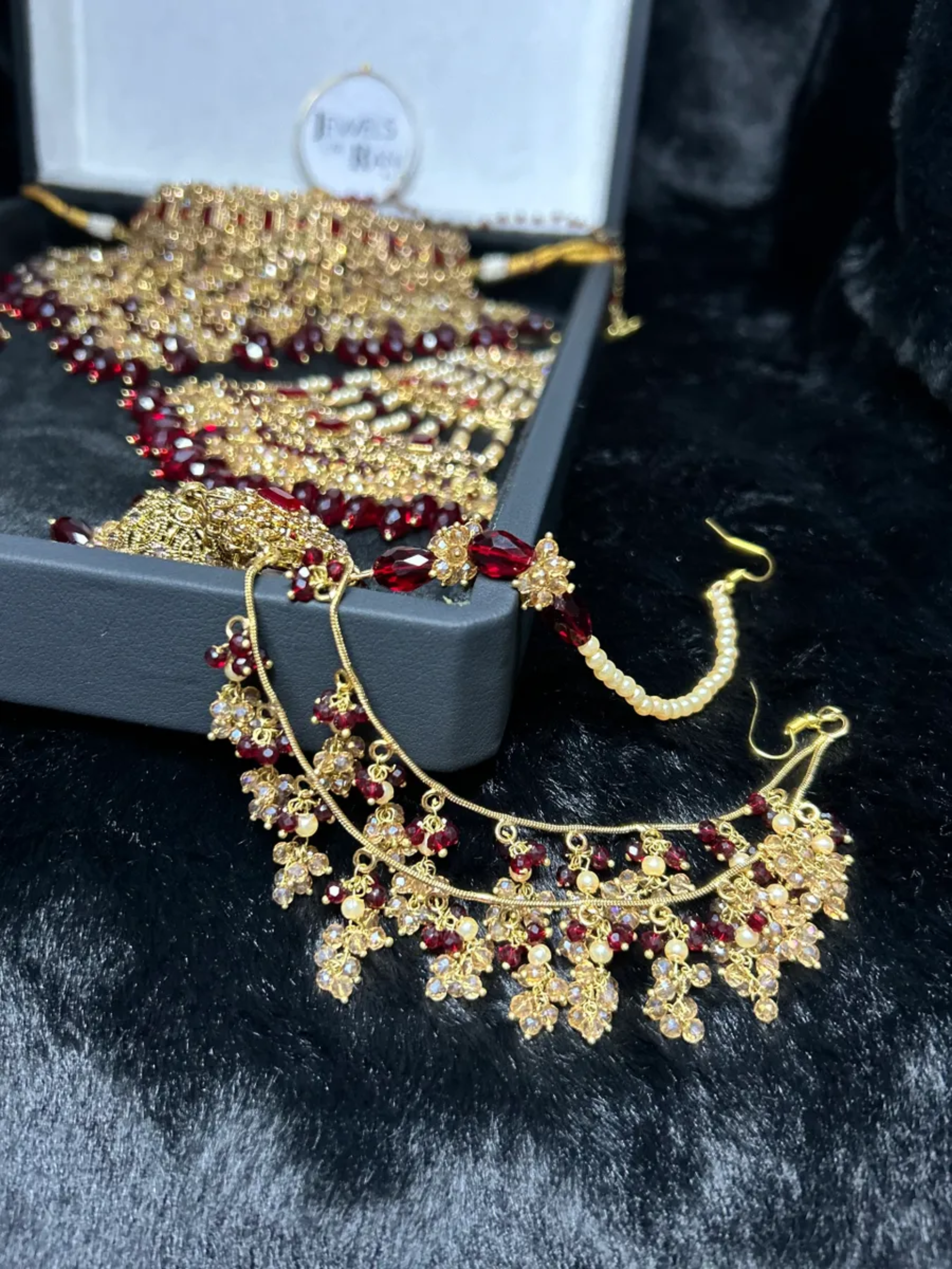 Trending Dangled Crystal Maroon 24crt Gold Plated Bridal Jewellery Set