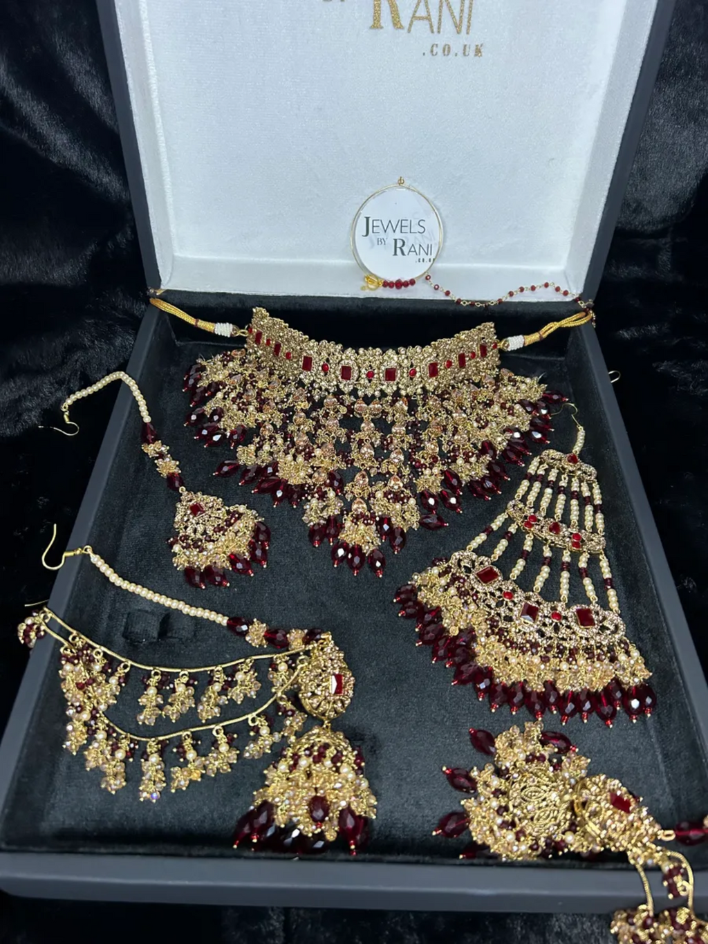 PRE ORDER: 6 Week Making time- Trending Dangled Crystal Maroon 24 crt Gold Plated Bridal Jewellery Set - Jewelsbyrani