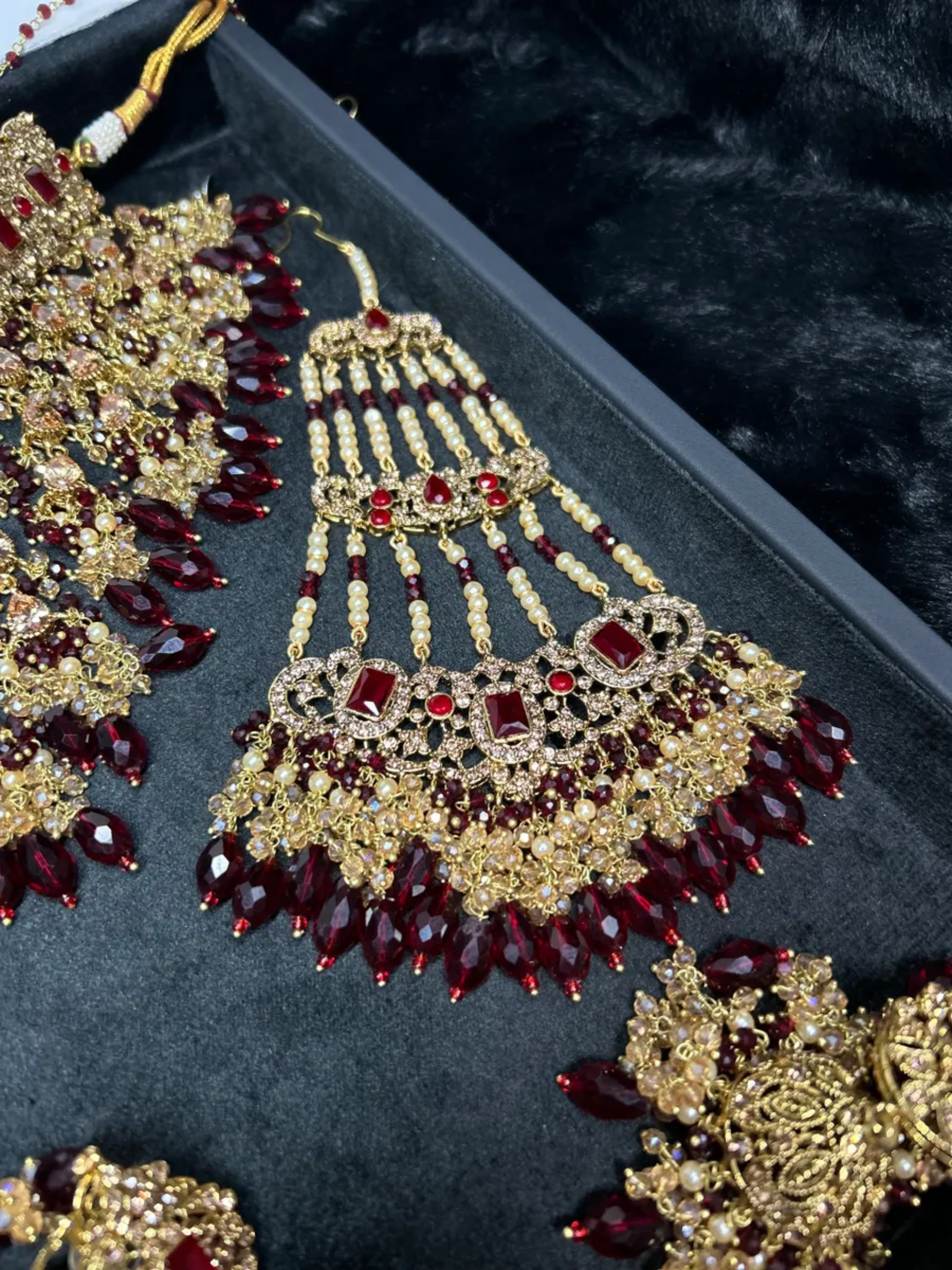 Trending Dangled Crystal Maroon 24crt Gold Plated Bridal Jewellery Set