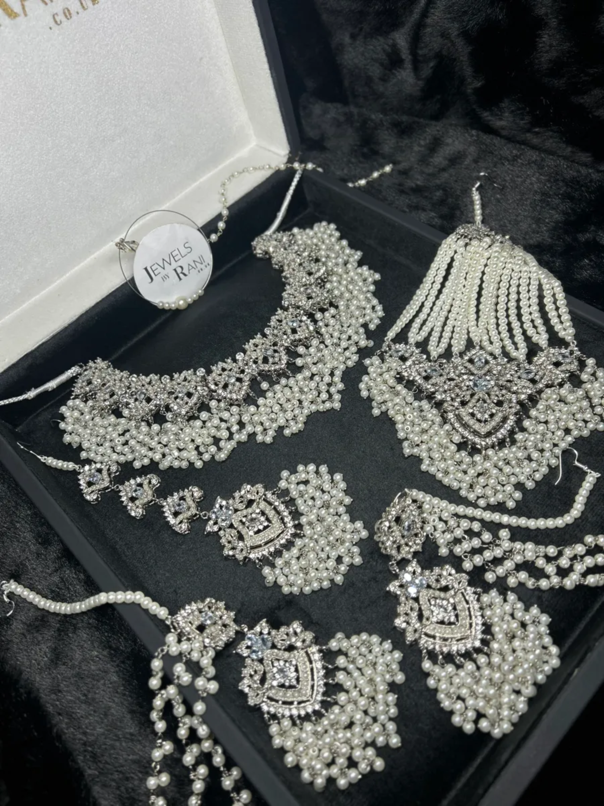 Stunning White necklace set, with heavily beaded earrings & tikka - Jewelsbyrani