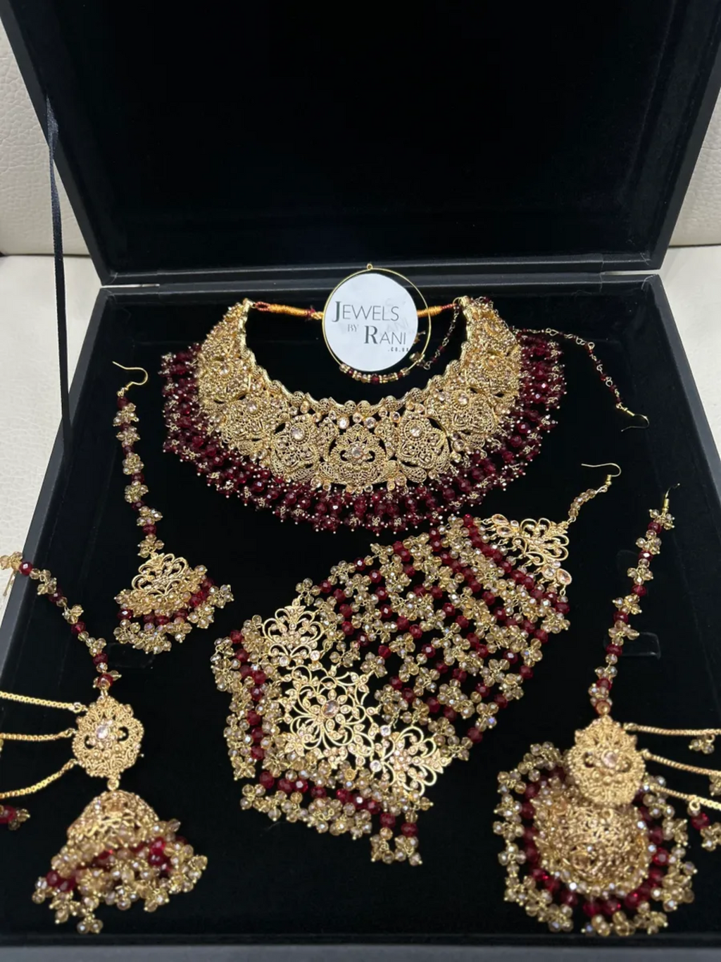 Deep Red & Gold Collar Necklace set, with heavily beaded earrings & tikka. - Jewelsbyrani
