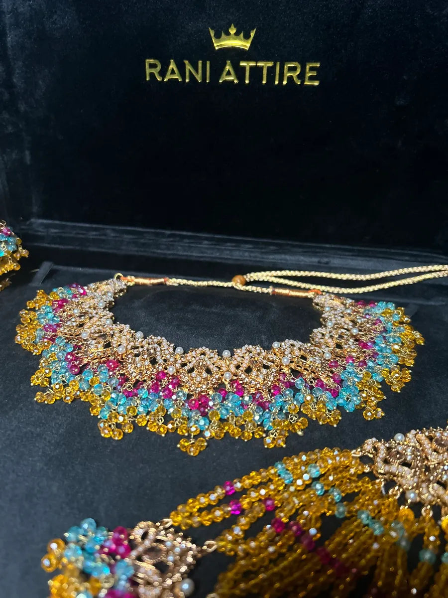 Mustard, Light Blue & Hot Pink coloured necklace set, with heavily beaded Jhumkies & tikka | Gold Stones - Jewelsbyrani