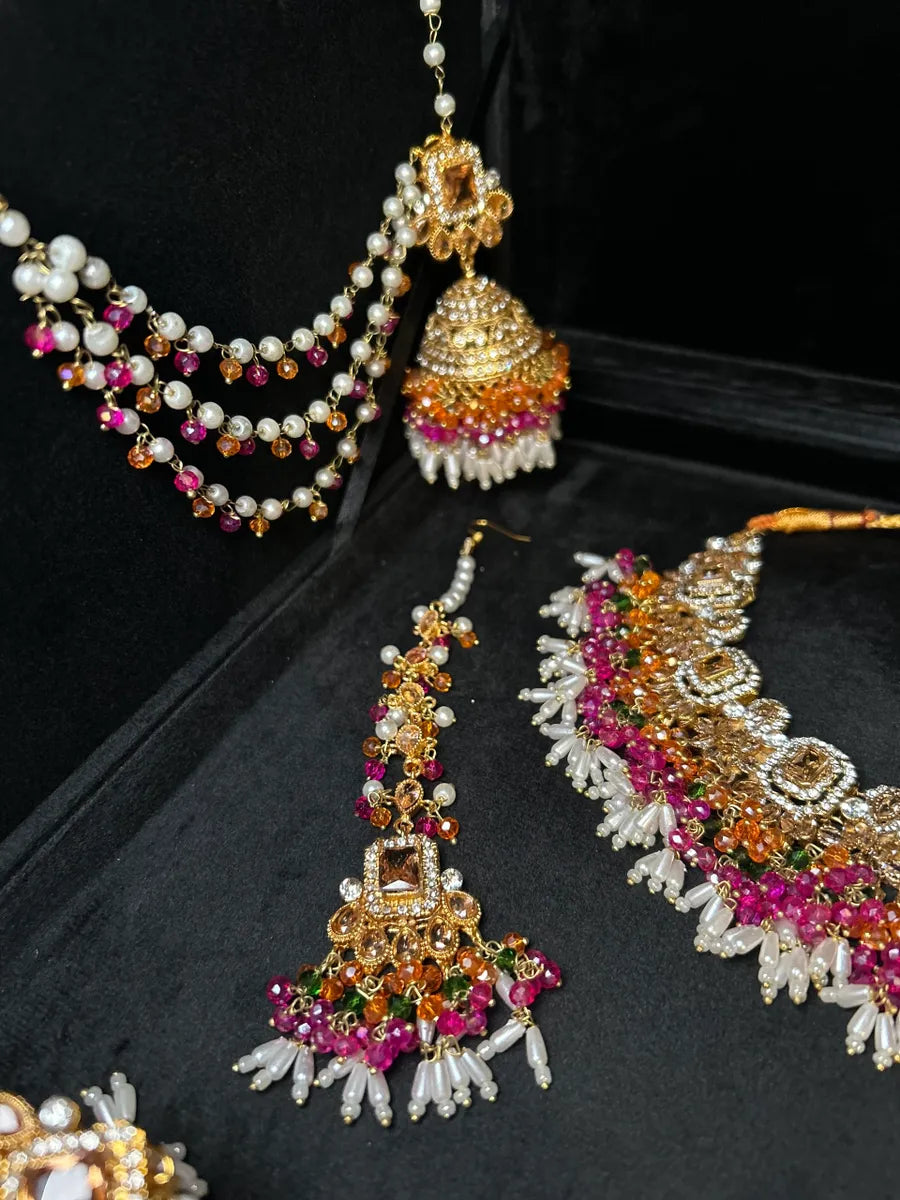 Dazzling Multi coloured necklace set, with heavily beaded earrings & tikka