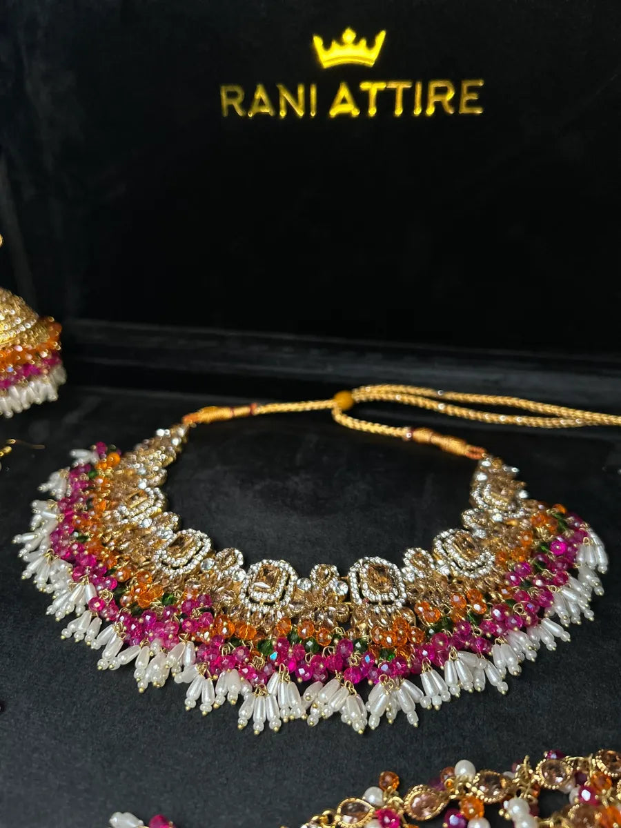 Dazzling Multi coloured necklace set, with heavily beaded earrings & tikka - Jewelsbyrani