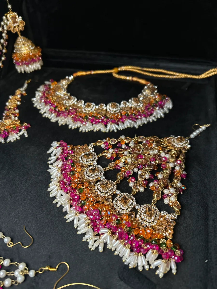 Dazzling Multi coloured necklace set, with heavily beaded earrings & tikka - Jewelsbyrani